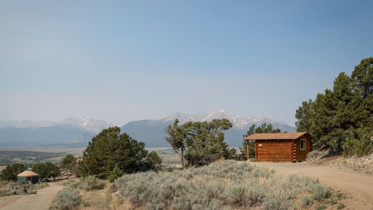 Buena Vista Cabin | 1 Room Dry Camping Cabin. Sleeps up to 4 in one queen bed and a set of twin bunks (bunk bed linens provided upon request).