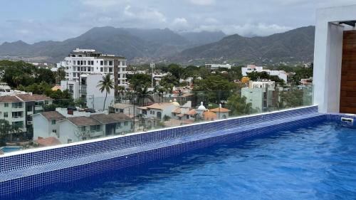 Diaz Ordaz Apartment | 15 Minute Walk to Beach KING Bed Rooftop Pool