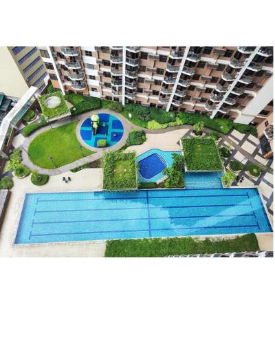 Pasay Apartment | 1BR Condotel in Pasay Manila Near NAIA Airport, Mall of Asia, Manila Bay, PICC and CPP Pet-Friendly with Pool, Fast WiFi, Netflix