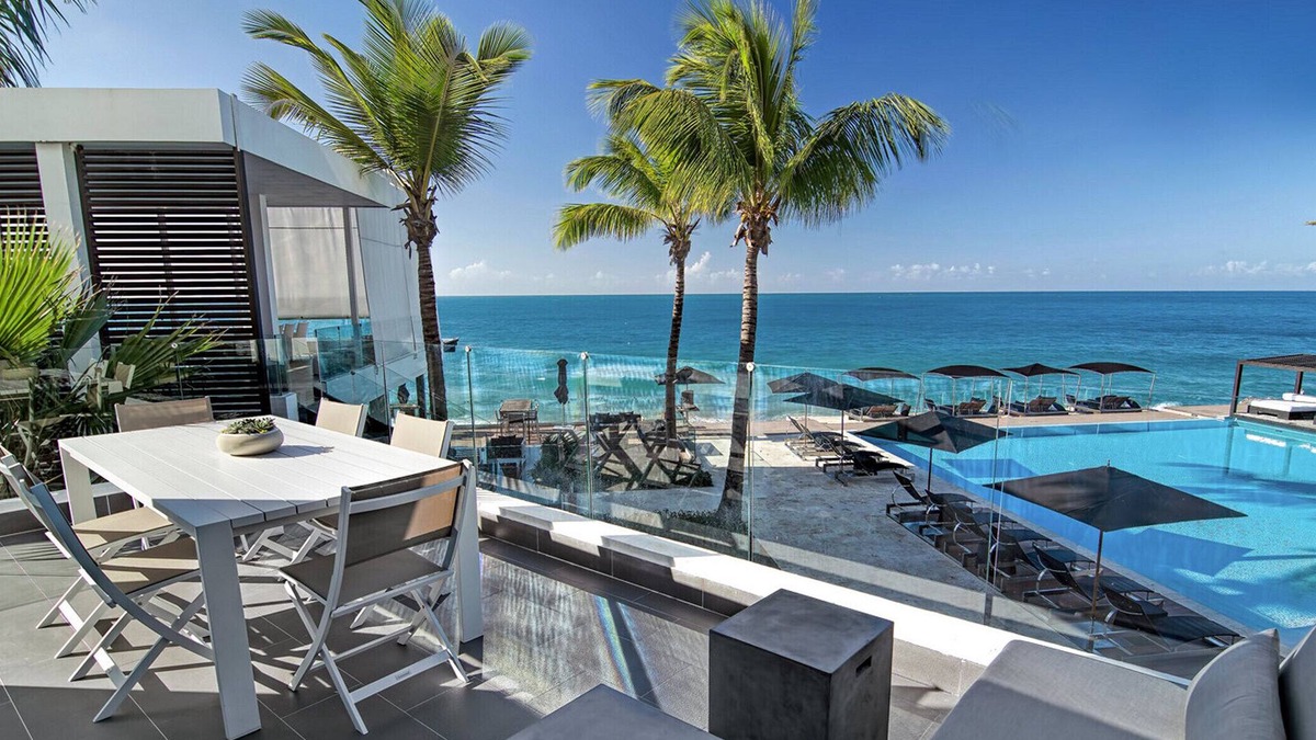El Batey Apartment | 2BD beachfront condo in gated luxury residence, gym/pool, near everything