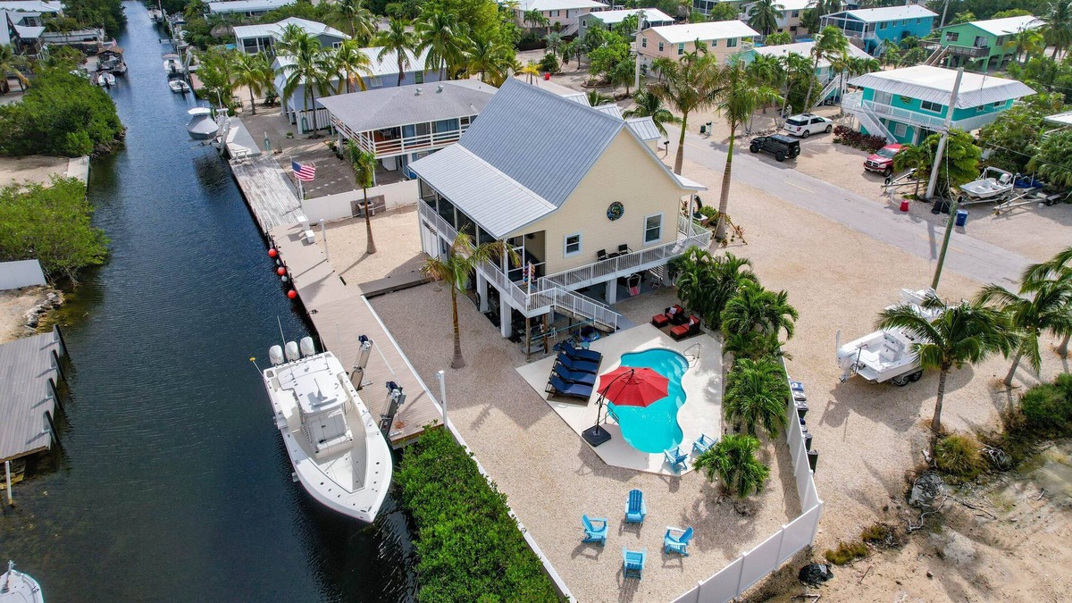 Breezeswept Beach Estates House | 3 Bed/2 Bath Canal Front Home in Ramrod Key 80' Dock and Pool