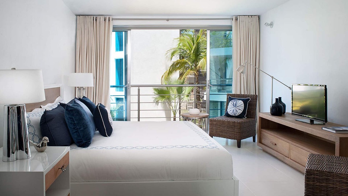 El Batey Apartment | 4BD groundfloor condo, pure beachfront, gym/pool/high-speed internet/cable TV