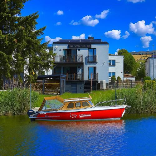 Ilawa Apartment | 4jeziora - prywatny dostęp do rzeki, pomost, ogrodem, wiata grillowa, rowerek wodny, kajaki w cenie, parking, psiaki dozwolone