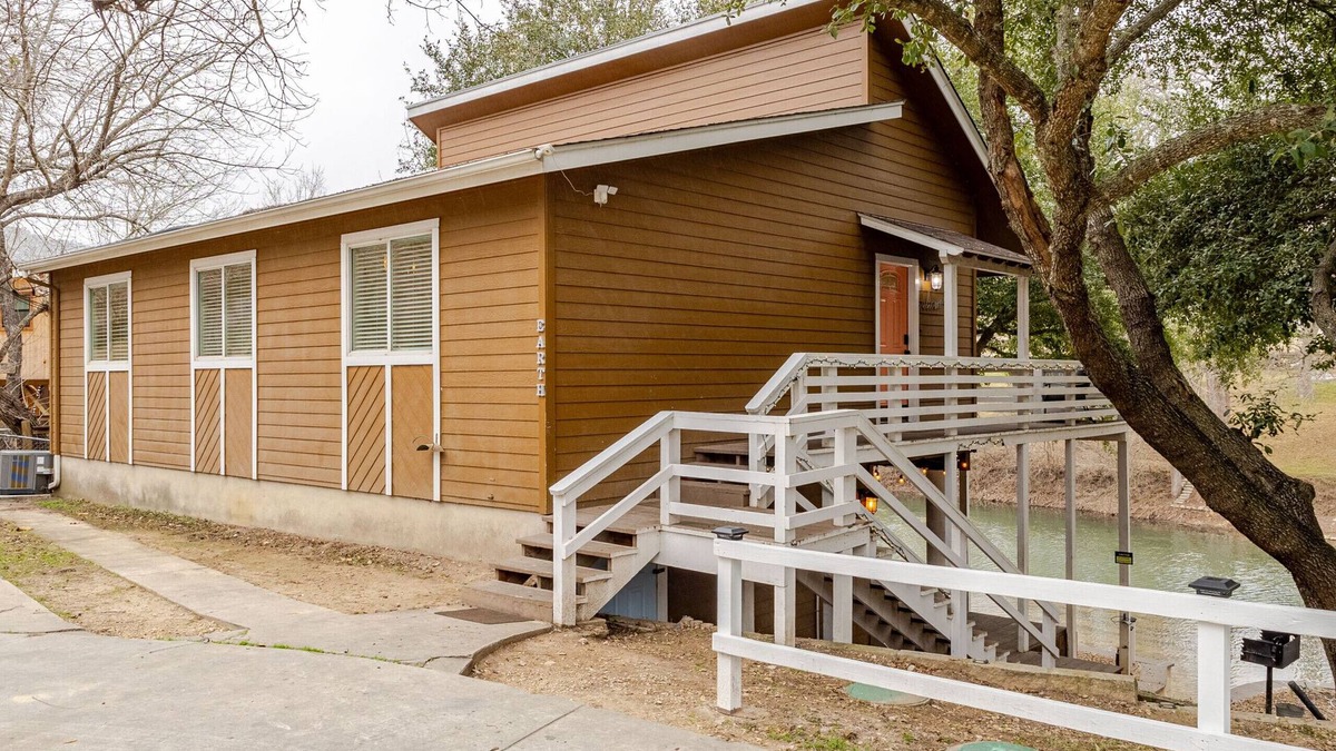 New Braunfels Ski Chalet | 5BR Riverfront Cabin, Steps to Water, Sleeps 18