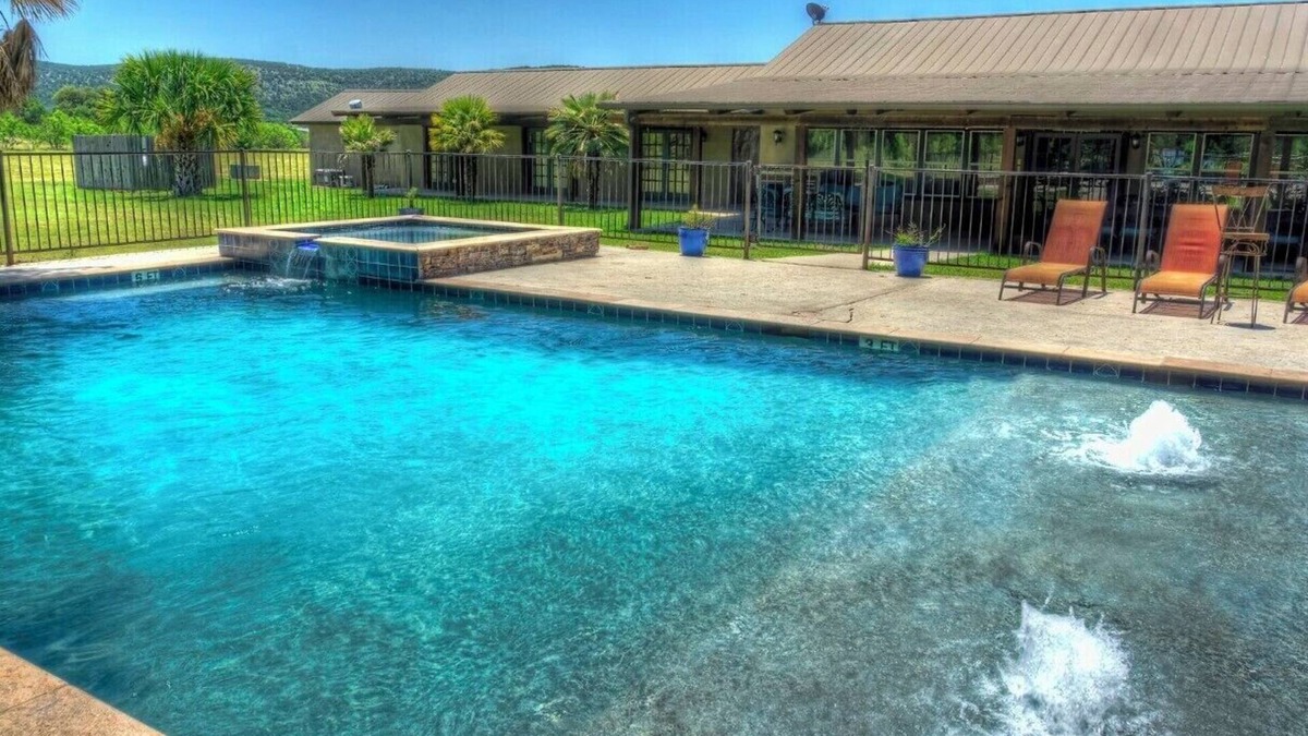 Sabinal Cabin | 6-bedroom Lodge on 12 acres in Concan, Texas. Swimming pool & hot tub.