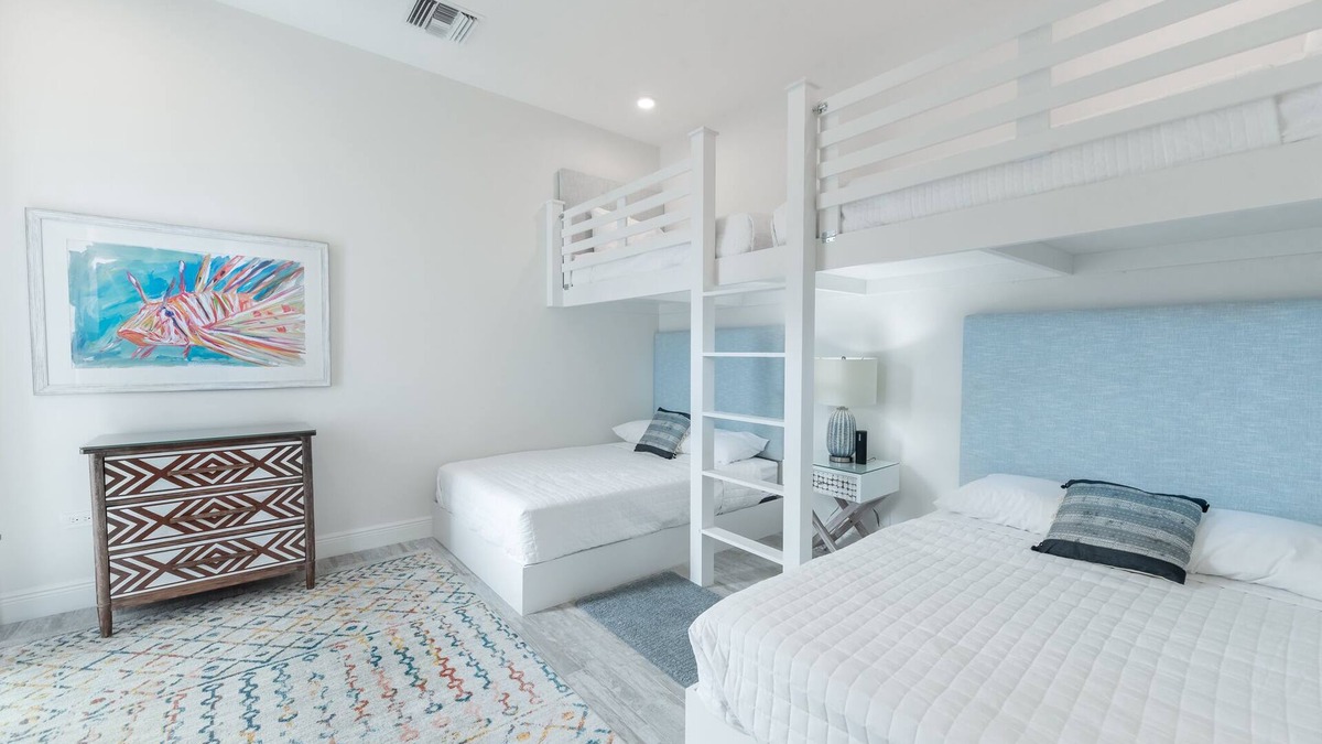 West Bay Condo | 7 Mile Beach Beach Club and Pool Pavilion. Ocean views from Roof Terrace