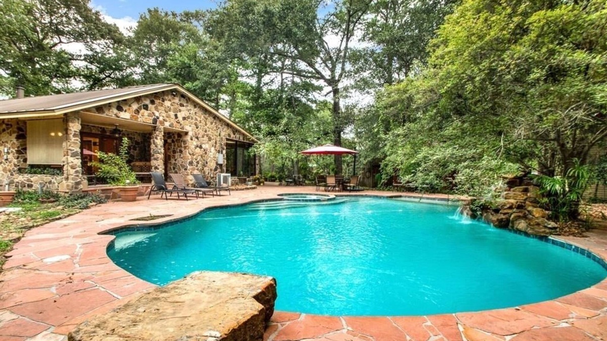 Tomball Cottage | 8 acres of fun & relaxation in a beautiful Rock Cottage with a pool and hot tub