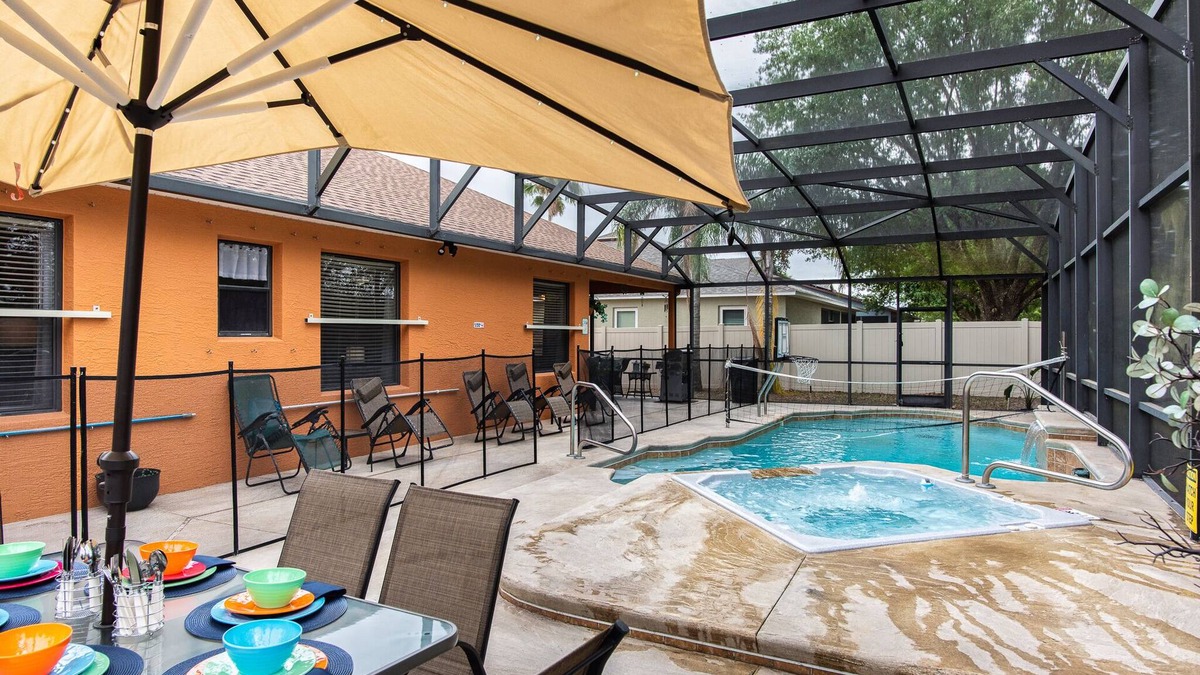 Wedgefield House | A peaceful tropical oasis with a large saltwater pool and spa hot tub.