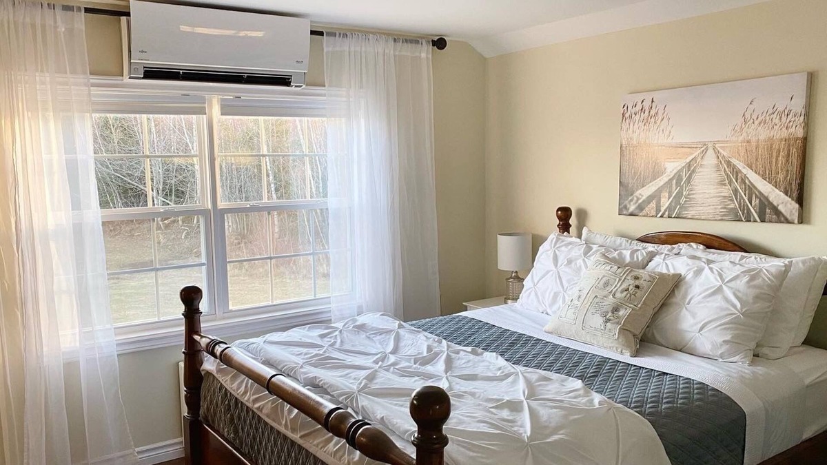 River John House | A Riverside Loft in a Log-Framed Barn