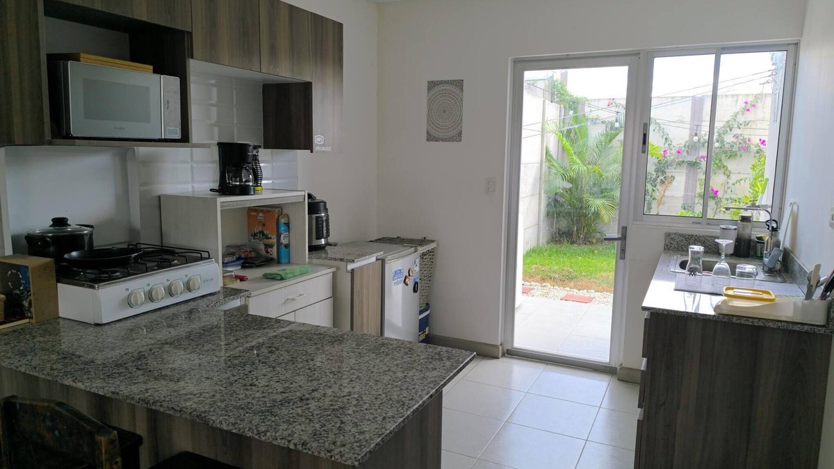 Guacima House | Alajuela Stay: Close to Airport, Viva Park & CAR with amenities like pool & gym