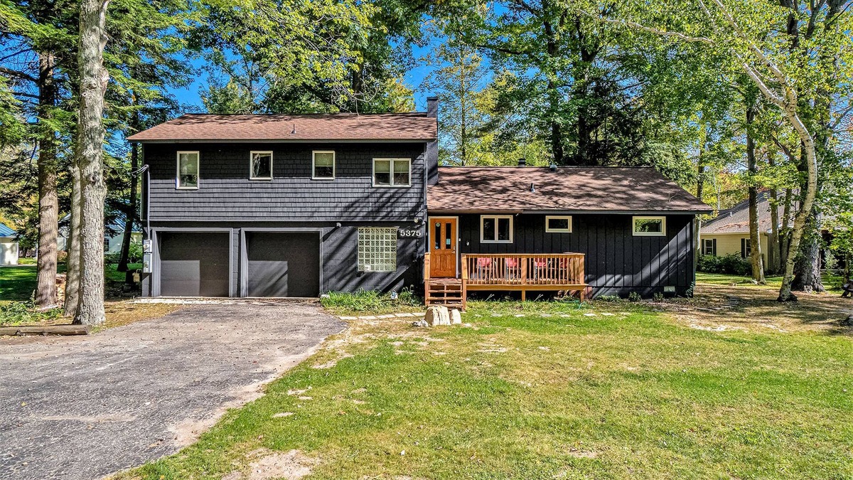 Lake Township House | Amazing riverfront retreat with firepit, patio, W/D, & great views