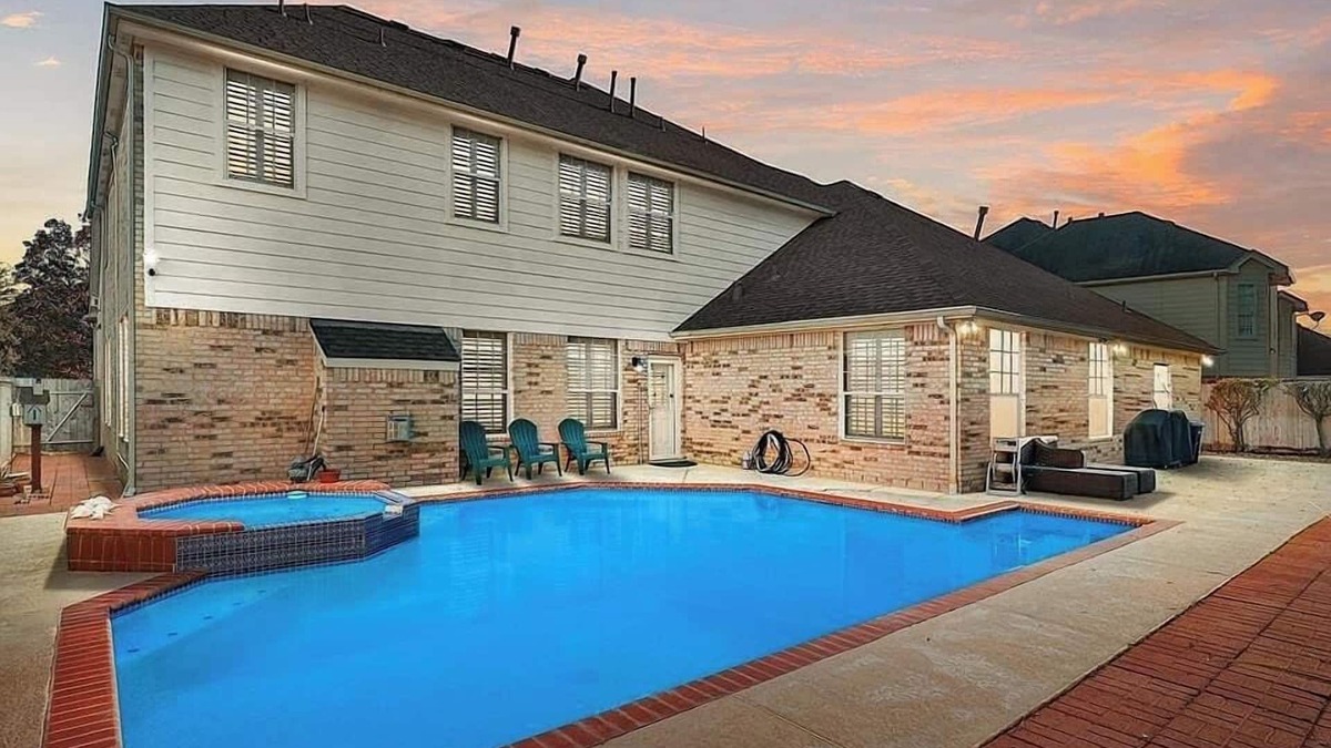 Champion Forest House | AMHOT - in Houston with heated pool spa