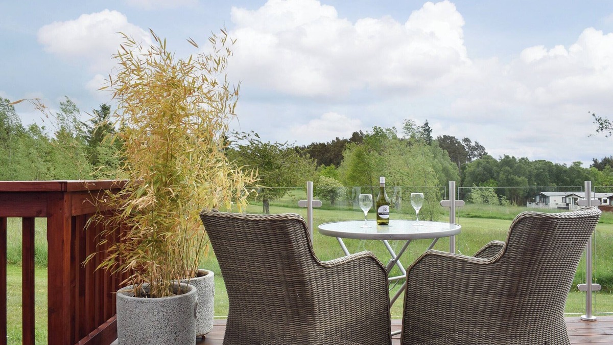 Swarland Cottage | An elegant lodge with lovely raised deck to relax overlooking the golf course.
