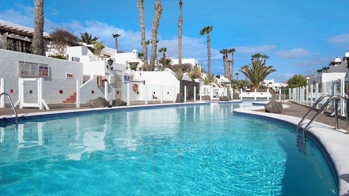 Playa Blanca Apartment | Apartment "Puerto Chico Q" with Sea View, Shared Pool, Terrace, A/C & Wi-Fi