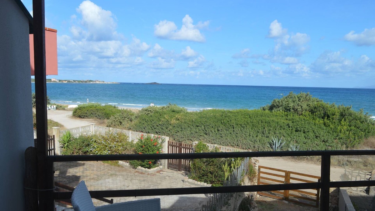 Sa Rocca Tunda Apartment | Apartment with veranda overlooking the sea 20 meters from the beach of the locality immersed in the