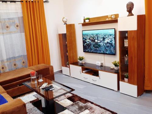 Douala Apartment | Appartement Cosy & Chill avec Groupe Electrogène, Forage, Parking, Gardien et WiFi