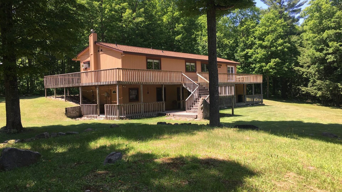 Deerton Cabin | Atv-Snowmobile Trail, sits on the Laughing Whitefish River, sleeps 16 people.