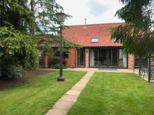 Stratton Strawless House | Barn with countryside views in private garden