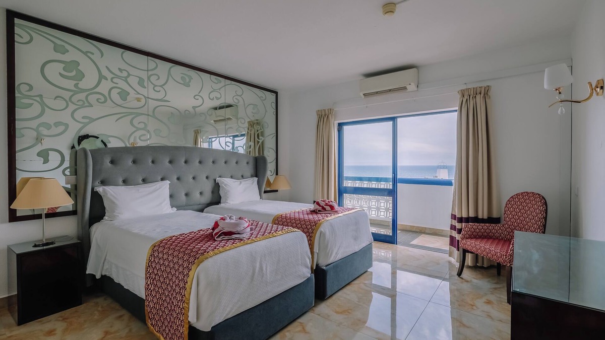 Oura Hotel | Beachfront Hotel with Indoor & Outdoor Pool! 2 Homely Units with Full Kitchens!