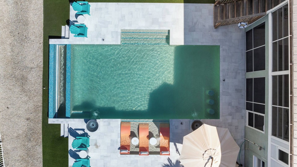 Mid Island House | Beachside Retreat: 2BD/2.5BA + Jet Ski Lifts + Epic Game Room & SHARED Pool!