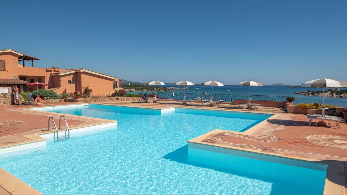 Golfo di Marinella Apartment | Beautiful apartment for 4 guests with pool, WIFI, A/C, TV, patio and pets allowed