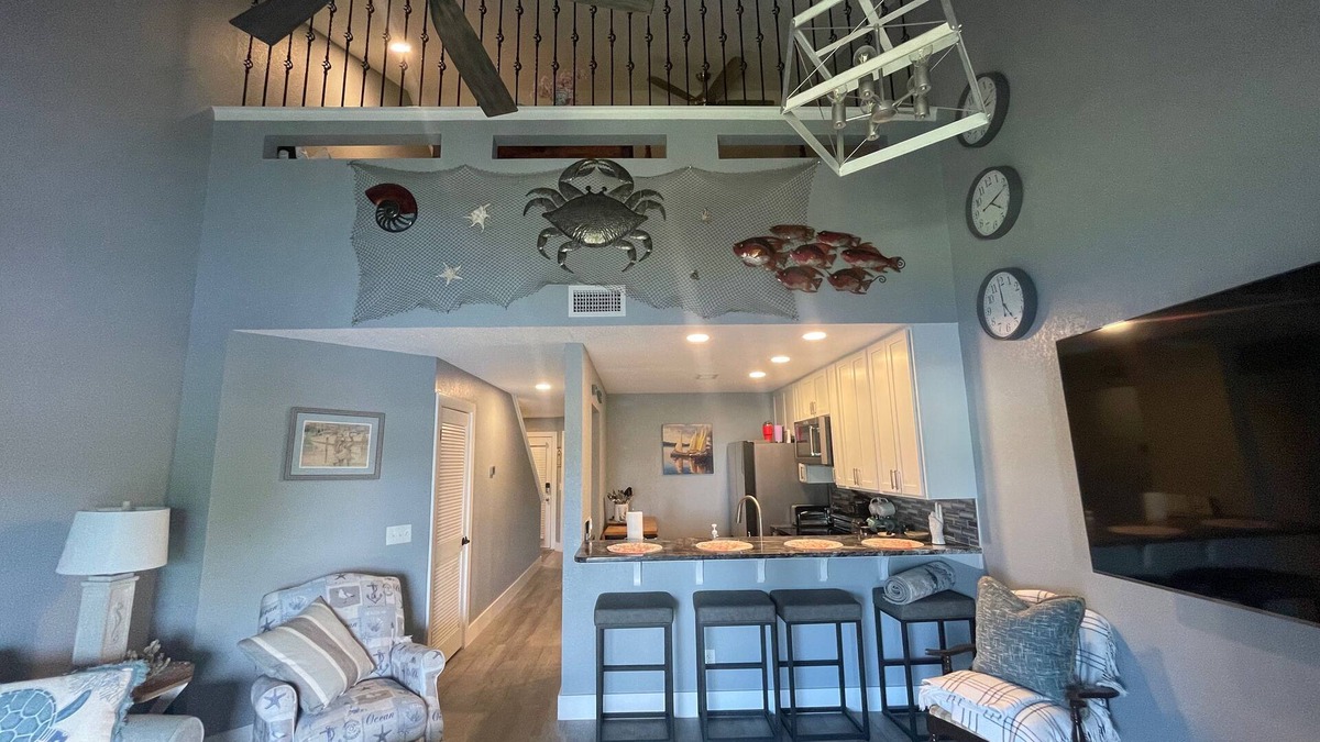 Thomas Drive Condo | Beautiful Lagoon-View Condo – 1BR + Loft in Gated Community, 5-Min Walk to Beach