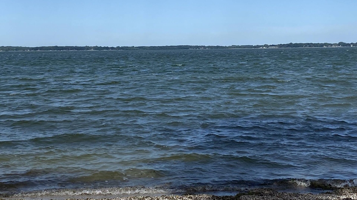 Spirit Lake House | Beautiful sunsets on sand beach of Big Spirit Lake front home!