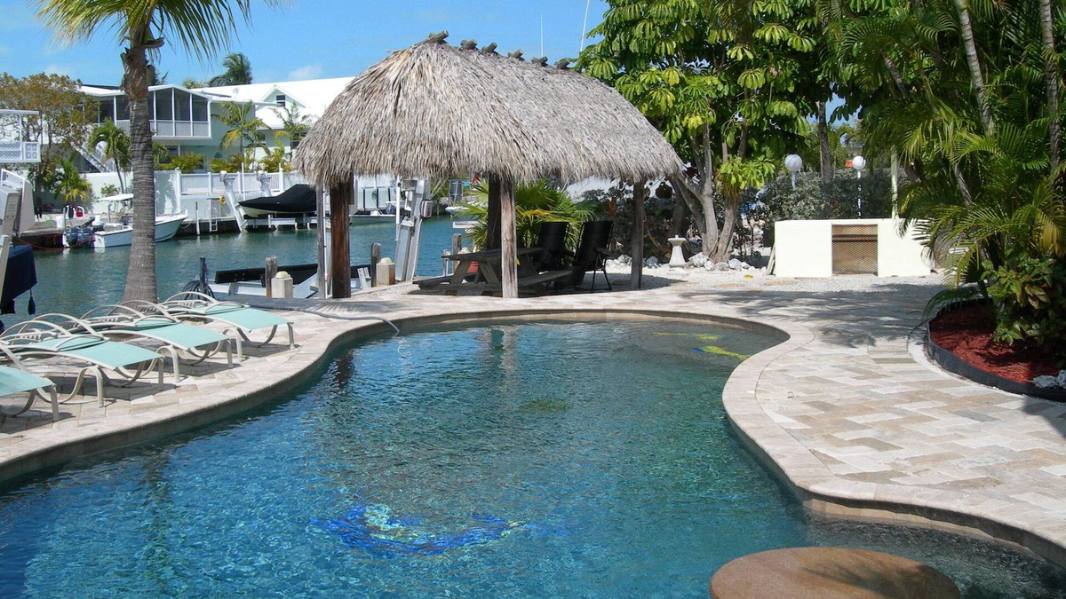 Venetian Shores Villa | Beautiful Venetian Shores, Cozy home, Heated pool, Tiki, Boat Lift, Fish & Dive.