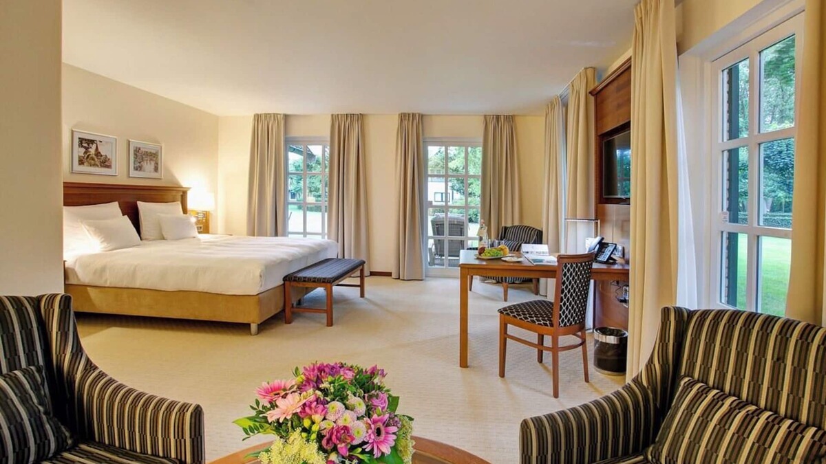 Ootmarsum Hotel | Beautifully Lit Room Overlooking Lush Parkland in Ootmarsum with Wellness Area
