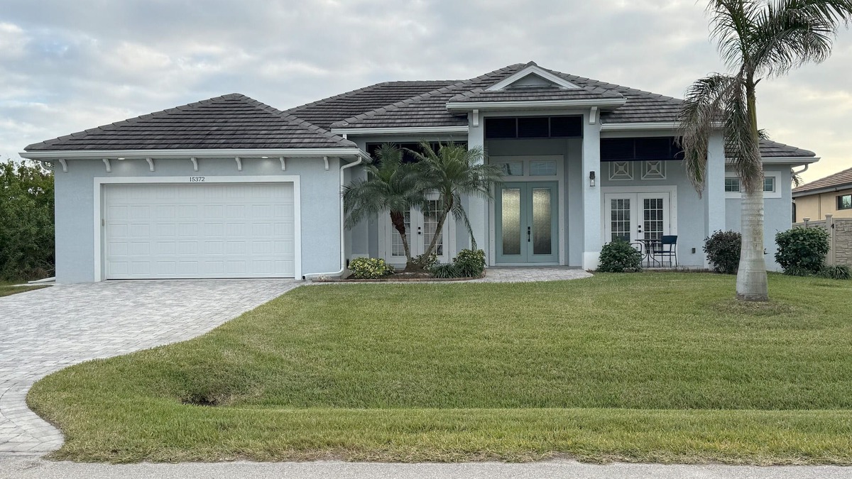 South Gulf Cove House | Bela-Vita-Charming 3-bedroom canal front pool home with 2 master suites