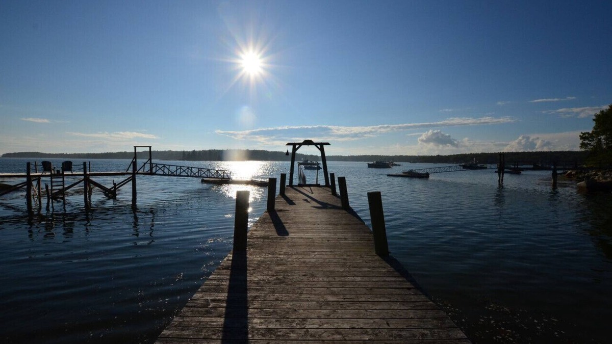 Spruce Head Cottage | Berry Cottage, private dock, overlooking a sandy beach and bustling harbor