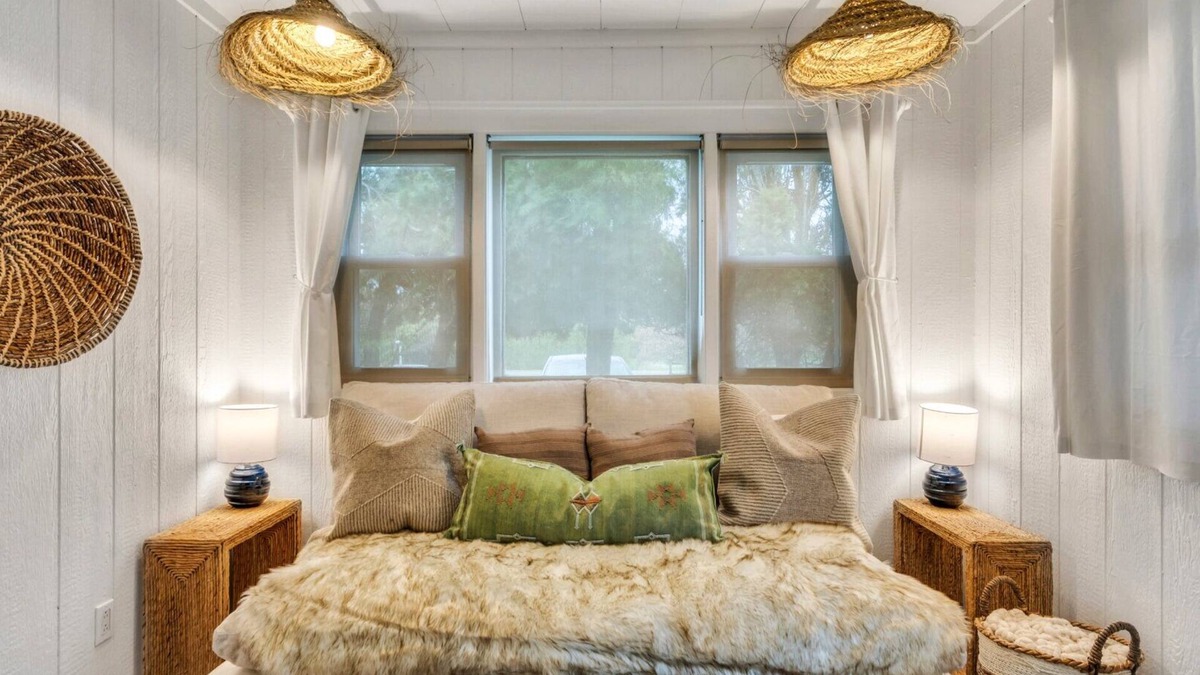 Montauk Apartment | Bohemian-style hotel unit with ample natural light, a cozy seating area,.
