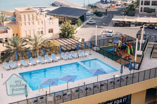 Al Hamra Village Apartment | Brand New Studio Canal View
