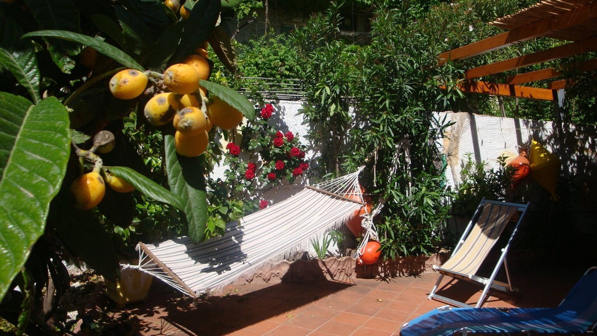 Cala Gonone Apartment | Bright and comfortable apartment, 400 meters from sea. Garden, Air-Con,Terrace.