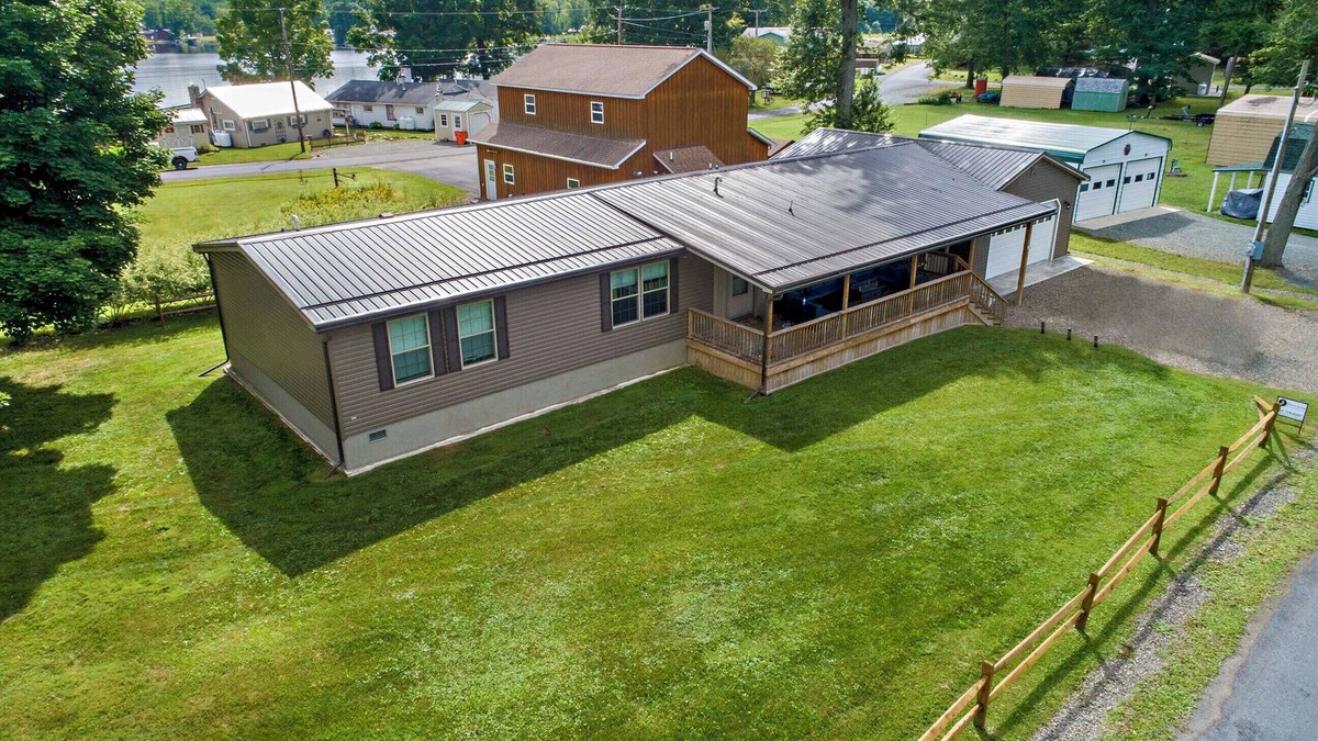 Bradford House | Bring your boat, this home offers a dock to tie up to and 10 feet of lakefront.