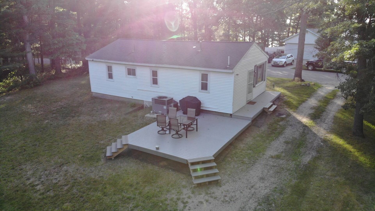 Newaygo House | Brookside Retreat- Charming home with lakes and rivers nearby