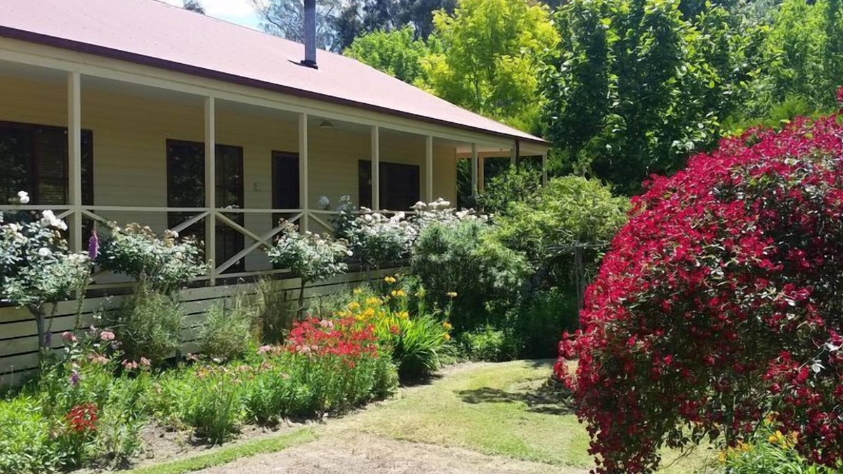 Buxton House | Buxton Gardens by the RivernCountry style home, river flowing thru the backyard