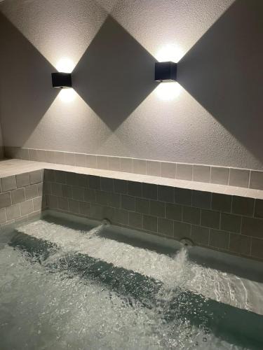 Calheta House | Calheta Suites - Vinha & Jardim - Adults-only suites met hottub & zeezicht