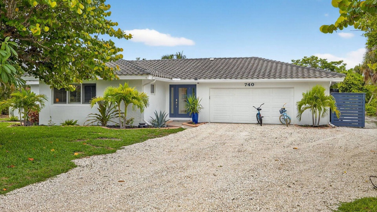 Sanibel House | Canal front ground level beauty steps to the beach