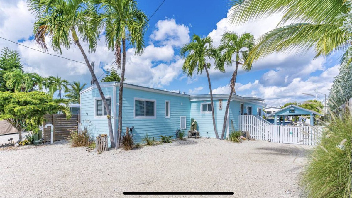 Key Largo Village House | Canal Front with Bay Access Home and private sandy beach.