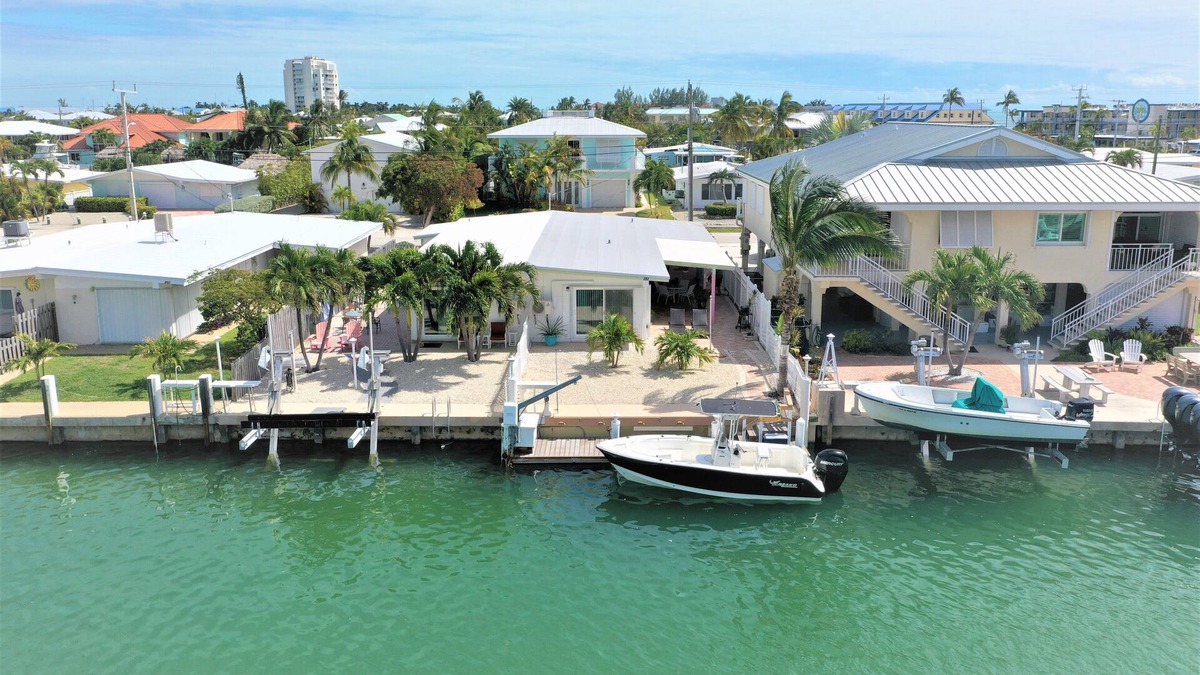 Key Colony Beach Villa | Canal-side Paradise: A Captivating 2/2 Duplex Villa with Cabana beach club pass