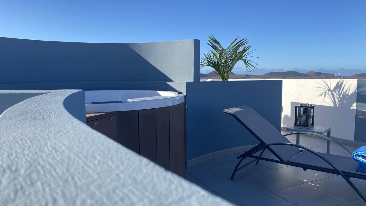 La Oliva Apartment | CASA MAGMA: apartment with roof terrace, private Jacuzzi, ocean & volcano views