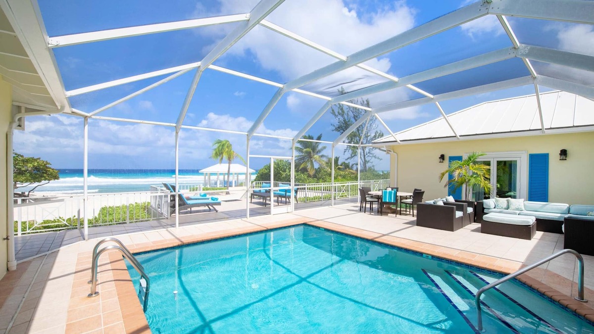 Old Man Bay House | Cayman Sands: Secluded Beach Villa with Pool Atrium & Guest Cottage