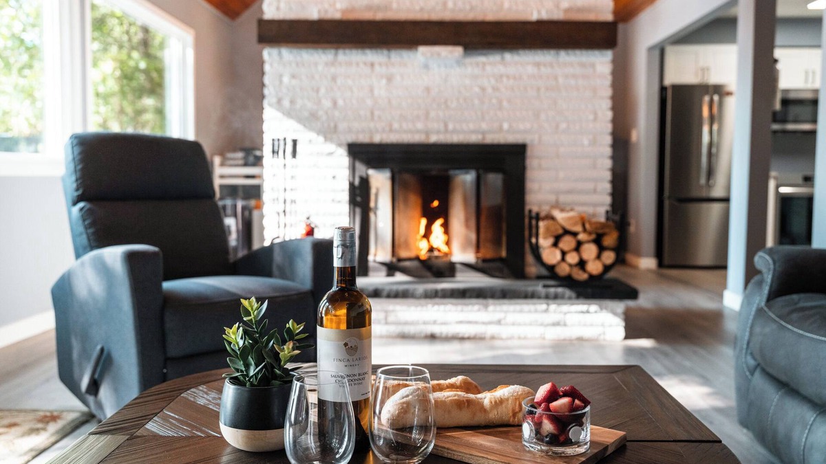 Minden Hills Cottage | Cedar and Sand Lakehouse on Lake Kashagawigamog | Fireplace | Firetable | Dock