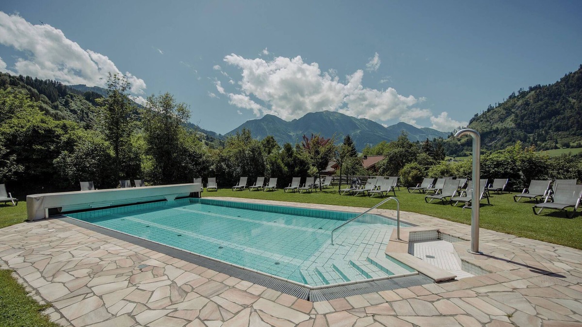 Sankt Johann im Pongau Ski Chalet | "Chalet Lerch" with Mountain View, Garden, Shared Pool & Wi-Fi