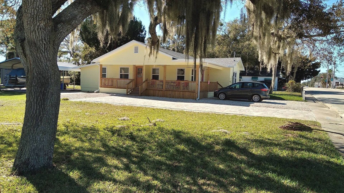 Edgewater House | Charming 3 bedroom 2 bath home w/wraparound veranda on one acre of land.