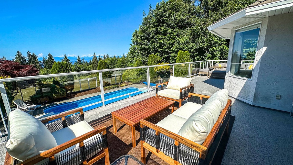 Regional District of Nanaimo House | Charming home with a private pool and inviting upper deck patio, perfect for relaxed outdoor living