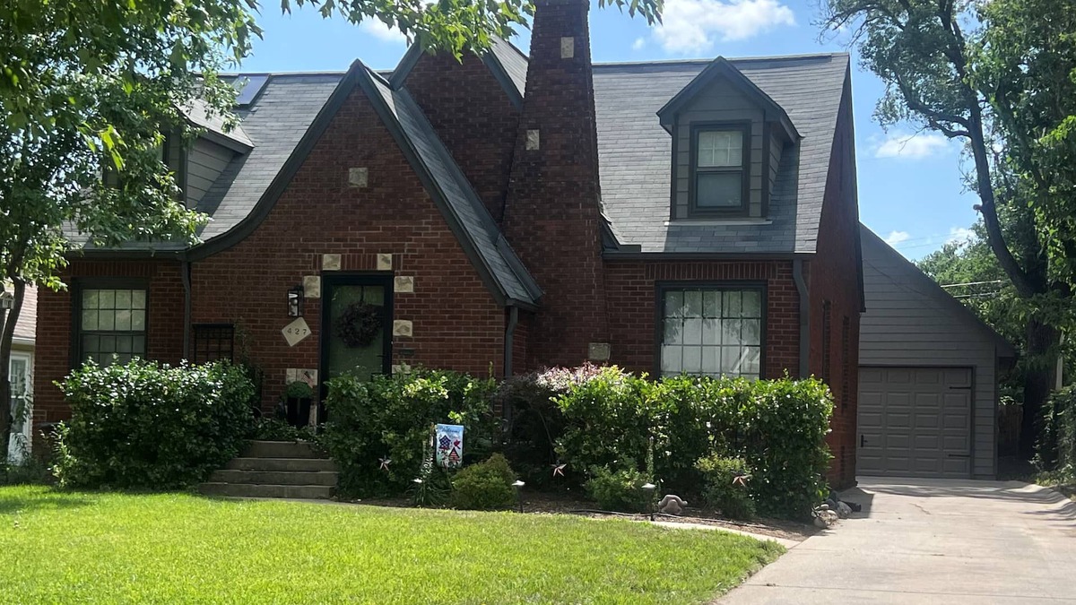 Wichita House | Charming Tudor Retreat in Perfect Location with Fenced Yard and Garage