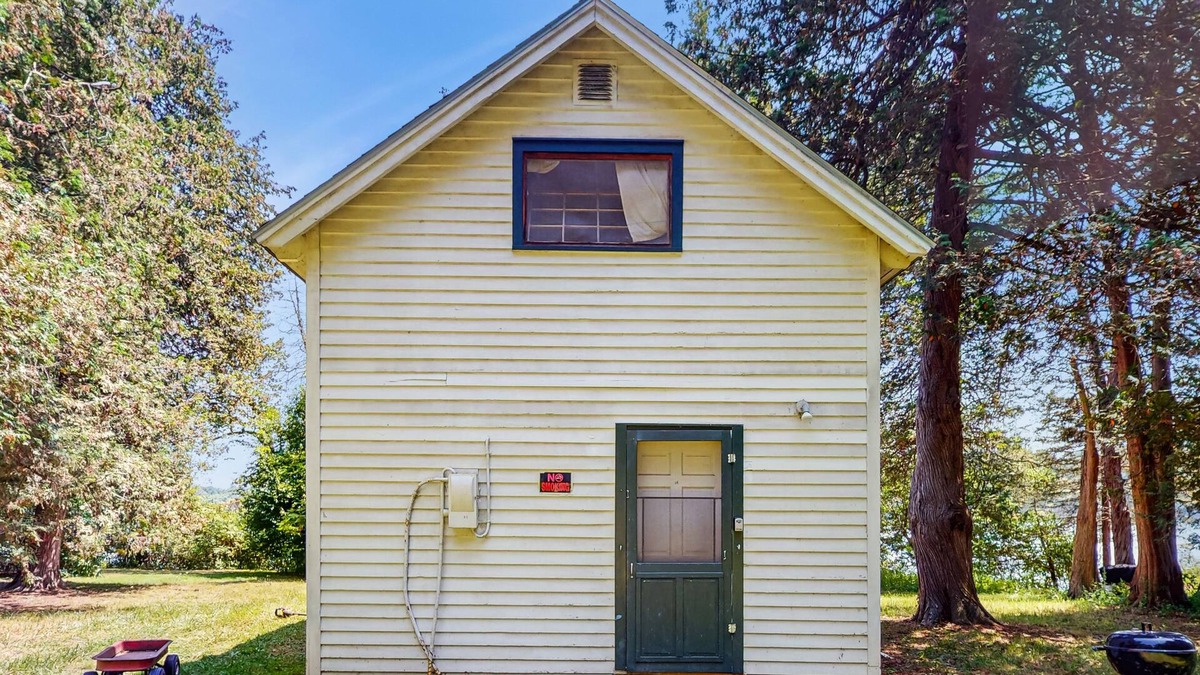 Charlotte Cottage | Classic lakefront cabin with screened-in porch & great views - dogs welcome