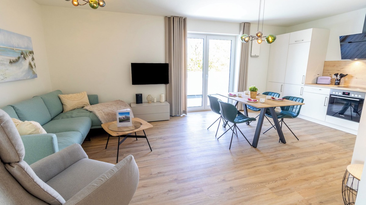 Tossens Apartment | Coastal pearl - comfort on the dyke. Roof terrace. Sauna. Family friendly.